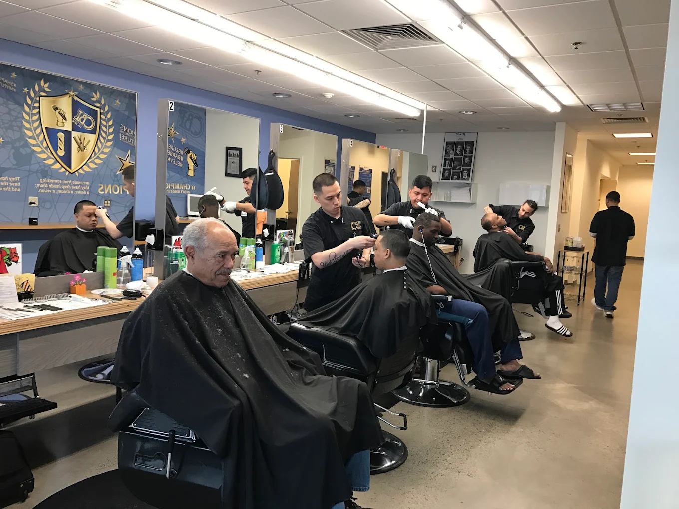 Inside Champion Barbershop — barber chair under warm light